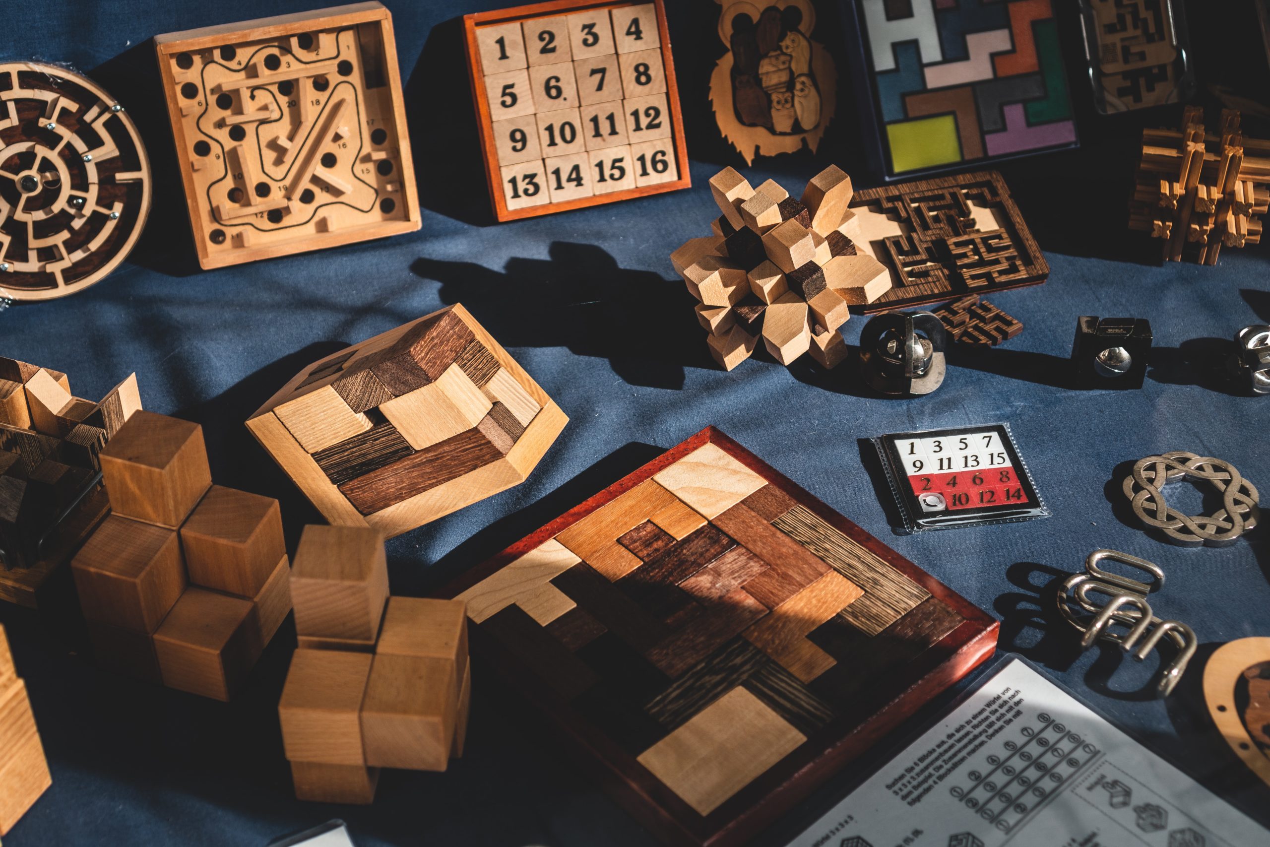 A collection of wooden, old-fashioned board games.